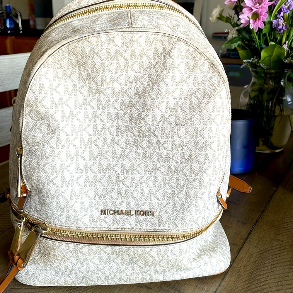 Michael Kors mini backpack. White and beige. Used
